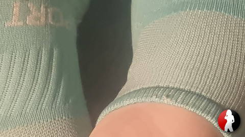 Füß Bilder mit türkisfarbenden Socken