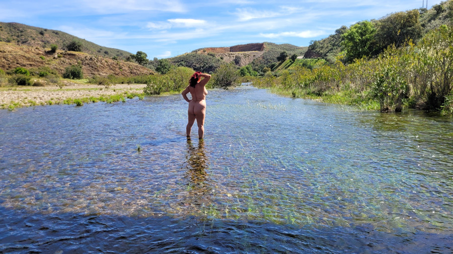 Standing naked in the river