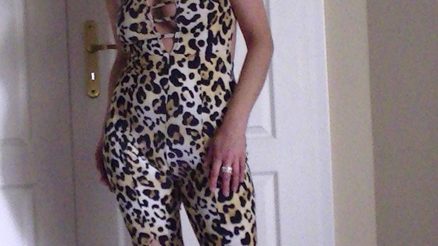Stripping in a leopard dress