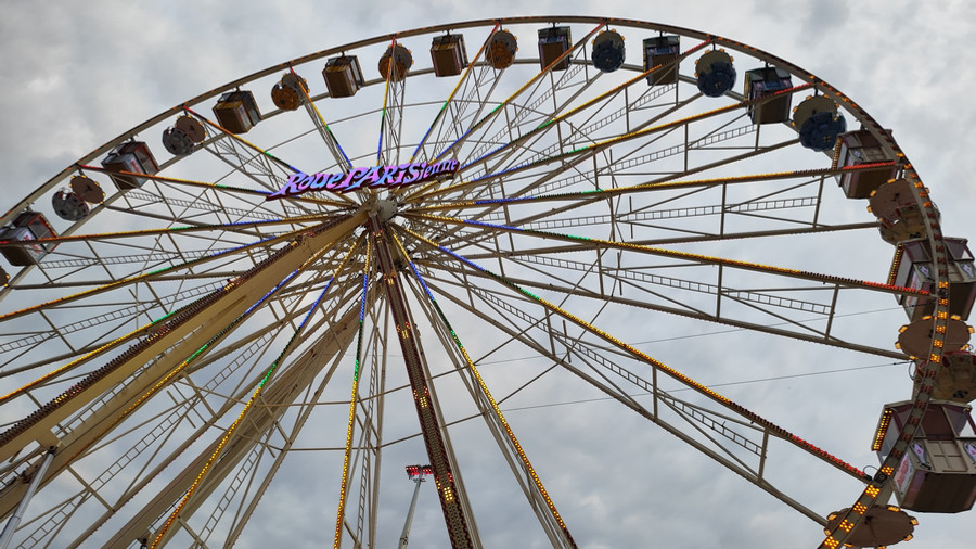 Leather pants and bare breasts in the Ferris wheel