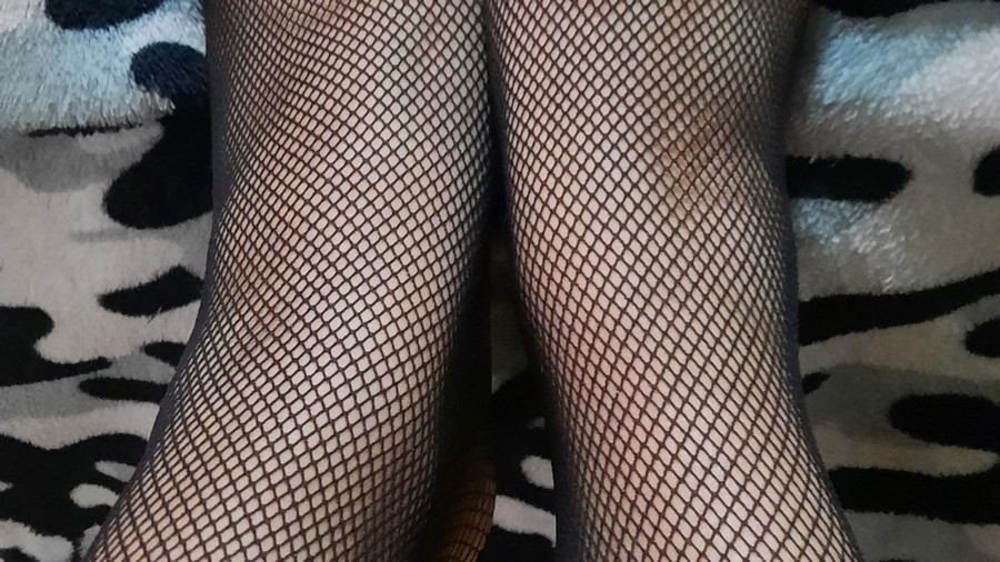 Wearing only fishnet stockings /