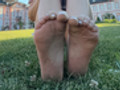 Dirty soles after hours of walking bare foot in the park