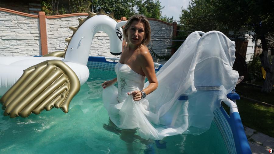 In the pool in wedding dress and fishnet pantyhose