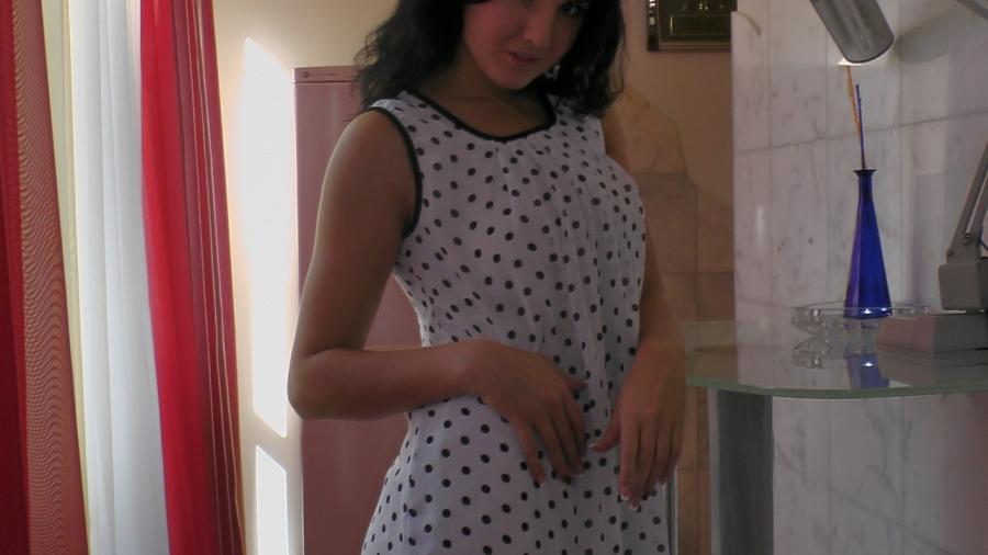 In a white dot dress